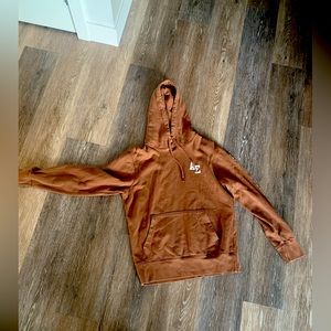 American Eagle brown sweatshirt with white letters.